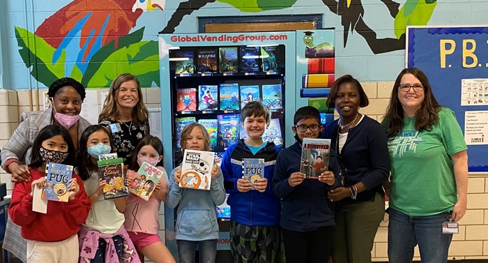 Ribbon cutting ceremony for our new book vending machine. Our top AR students got to pick new books!